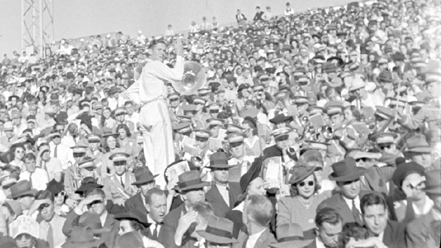A shot of the crowd at a football game in the 40s.