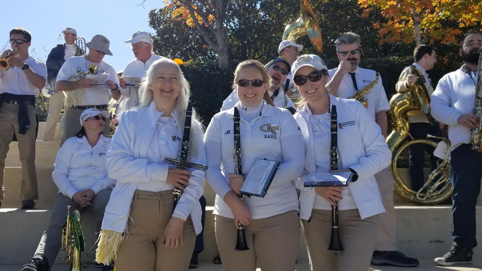 A group of Marching Band alumni pose before a performance.