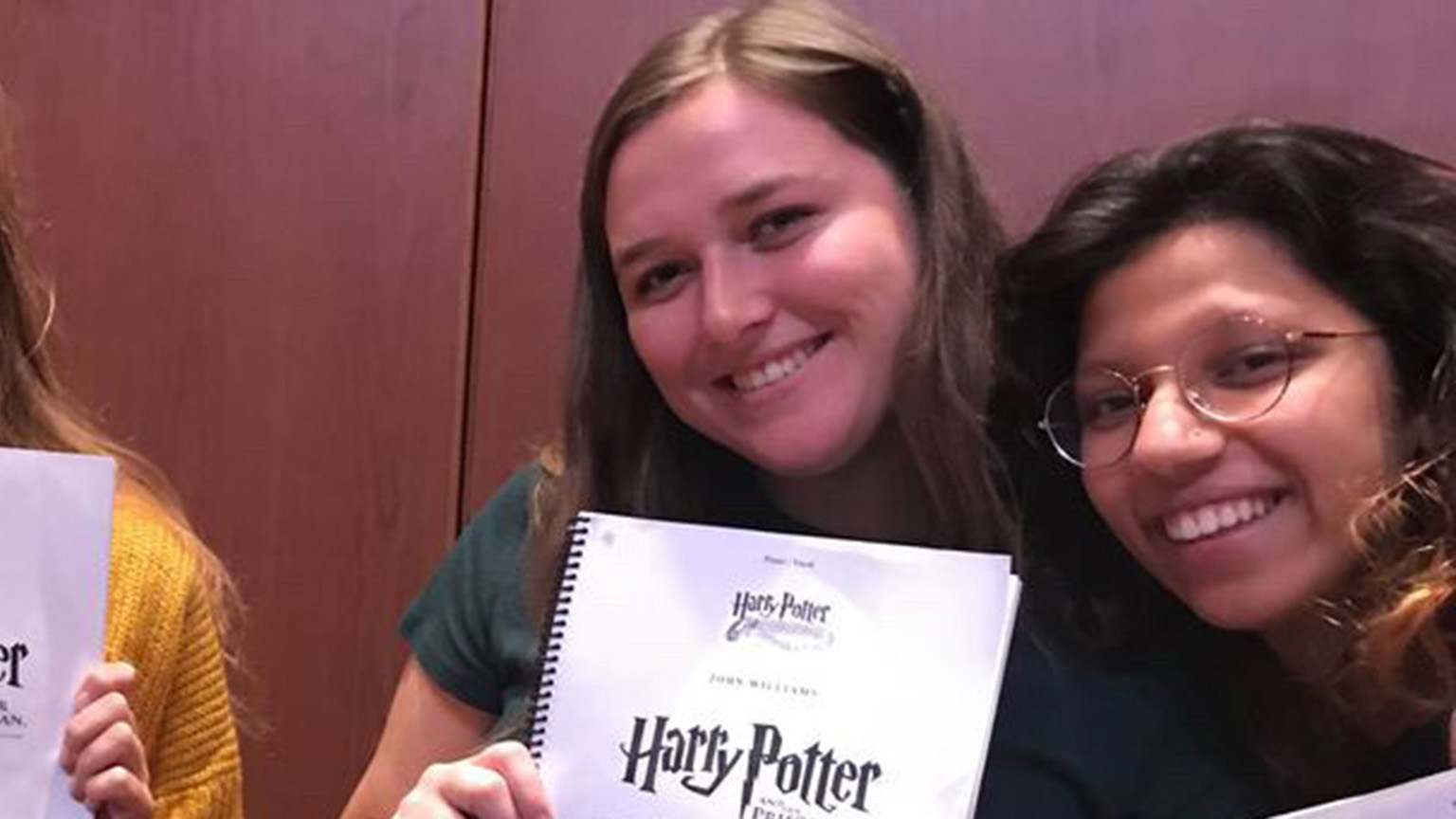 Kate Bosen posing with the score to Harry Potter and the Prisoner of Azkaban