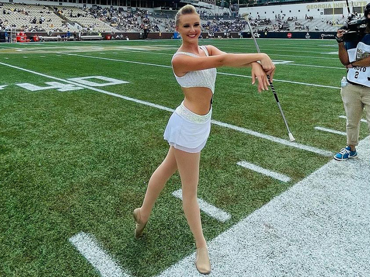 Georgia Tech "Golden Girl" poses on field
